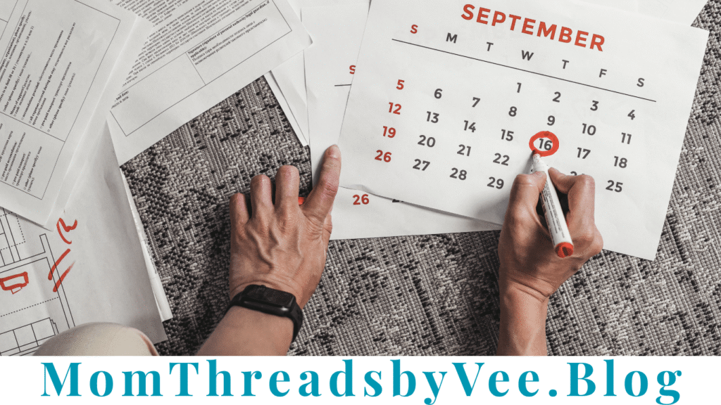 Blogger planning blog posts on a monthly content calendar
